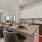 kitchen area on wooden floor with spacious counter-space and designer appliances