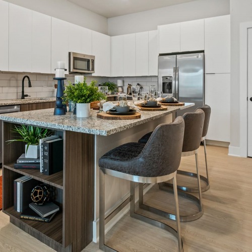 Kitchen spacious kitchen with a long counter and on wood-style flooring