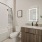 bathroom with a large mirror and modern counter-top