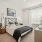bedroom with ample space for moving around the bed and entering other rooms